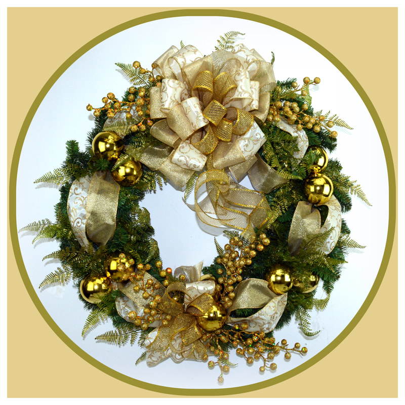 A Christmas wreath is adorned with gold balls, gold glitter berries, and a multi colored bow crafted from multi printed ribbons