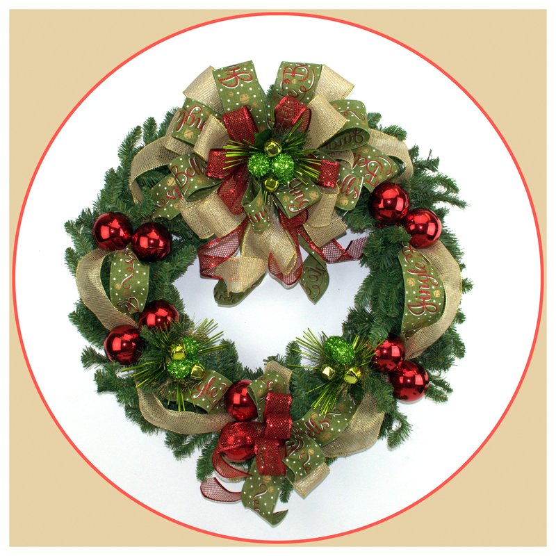 A Christmas wreath is adorned with multi colored ribbons, a large bow and small shiny red balls